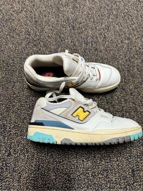 New Balance 550 White Sneakers with Yellow Logo and Blue Sole Accents